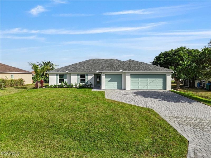 Front exterior of a new home in Cape Coral, Cape Coral, FL, highlighting curb appeal (Image 21).