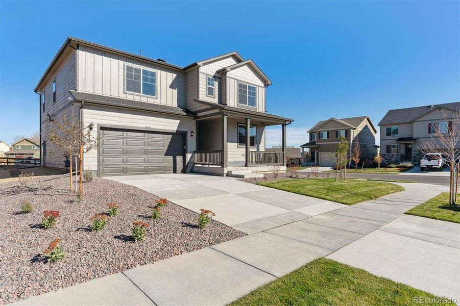 Front exterior of a new home in Trails at Crowfoot, Parker, CO, highlighting curb appeal (Image 2).