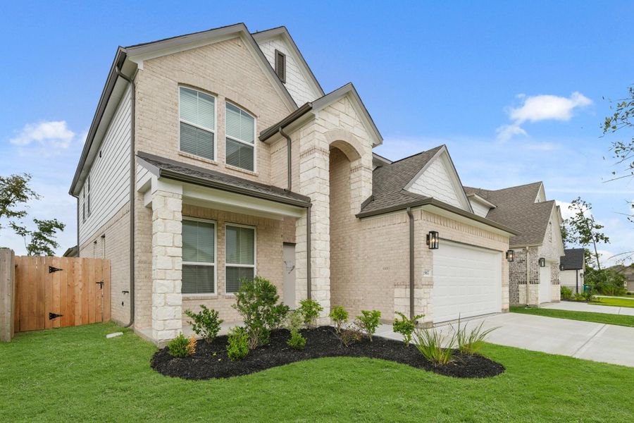 Front exterior of a new home in Barton Creek Ranch, Conroe, TX, highlighting curb appeal (Image 16). Front exterior of a new home in Barton Creek Ranch, Conroe, TX, highlighting curb appeal (Image 16).