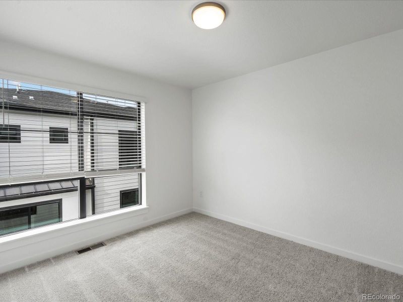 Spacious, unfurnished interior of a new home in The Hub at Virginia Village, Denver (Image 24).