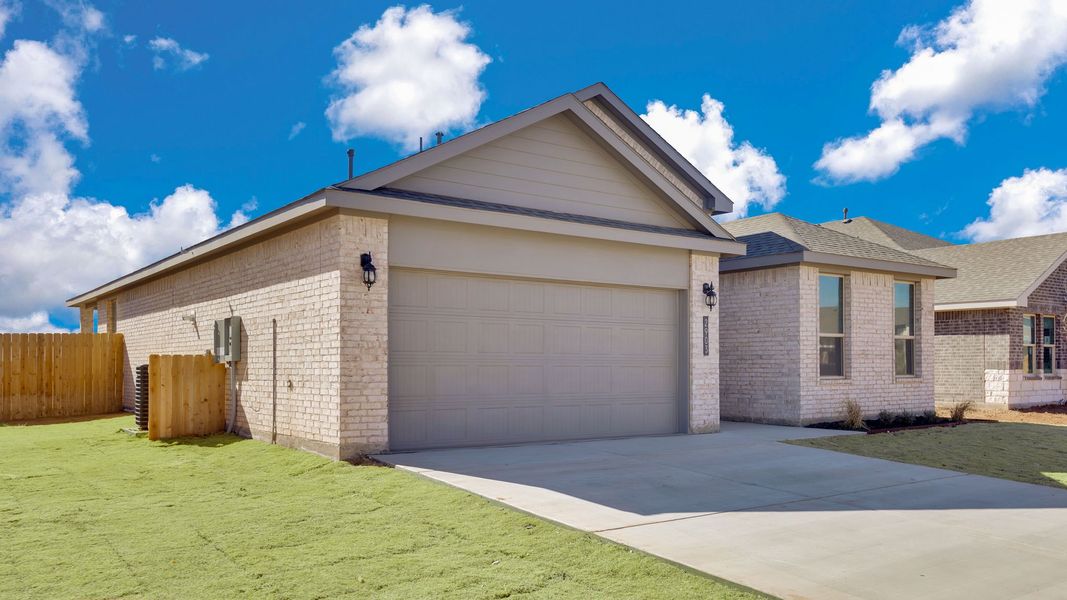Front exterior of a new home in Viridian, Lubbock, TX, highlighting curb appeal (Image 15).