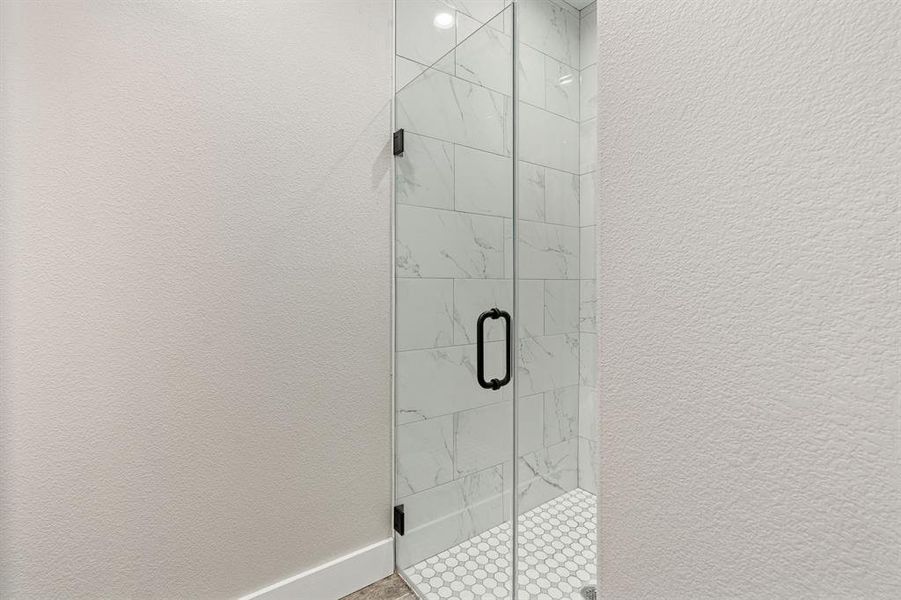 Bathroom featuring walk in shower