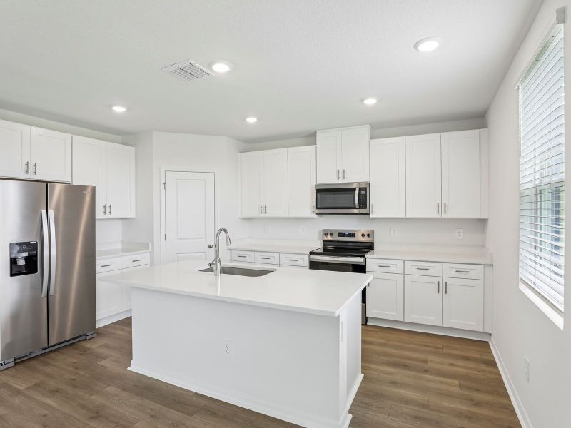 Furnished interior view inside a new home in Hilltop Vistas, Dade City (Image 3).