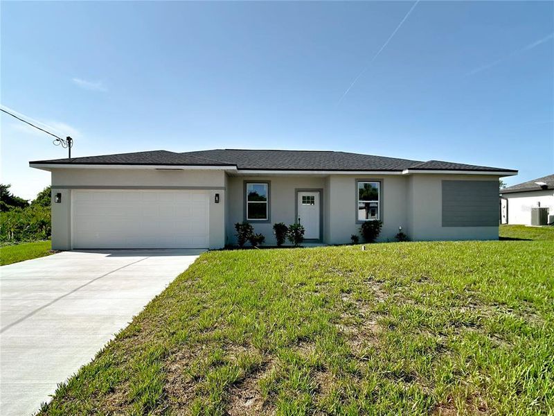 Front exterior of a new home in , Port Charlotte, FL, highlighting curb appeal (Image 13). Front exterior of a new home in , Port Charlotte, FL, highlighting curb appeal (Image 13).