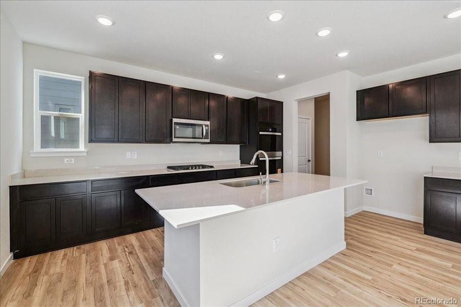 Furnished interior view inside a new home in Floret Collection at Alder Creek, Parker (Image 5).