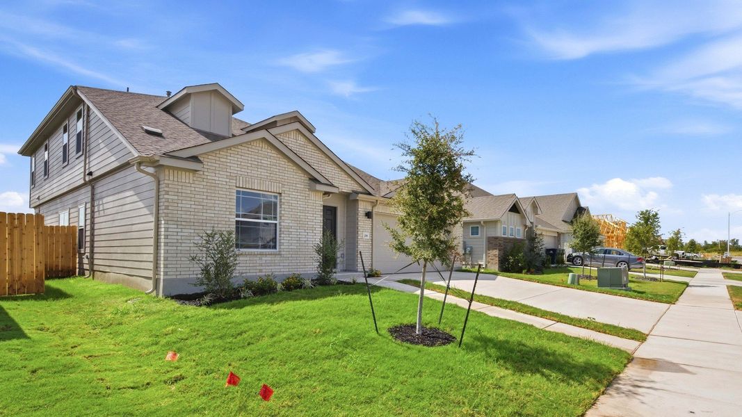 Front exterior of a new home in Sky Ridge, San Marcos, TX, highlighting curb appeal (Image 22). Front exterior of a new home in Sky Ridge, San Marcos, TX, highlighting curb appeal (Image 22).