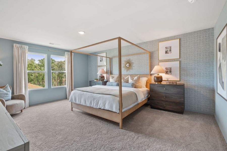 A bedroom with a large mirror. A bedroom with a large mirror.