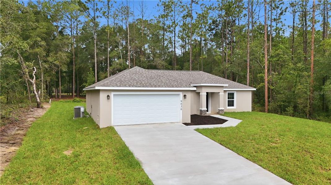 Front exterior of a new home in , Citrus Springs, FL, highlighting curb appeal (Image 21).