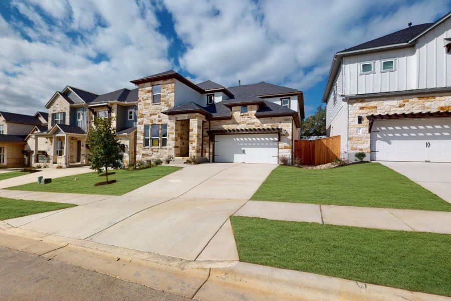 Front exterior of a new home in Edgewood, Leander, TX, highlighting curb appeal (Image 1).