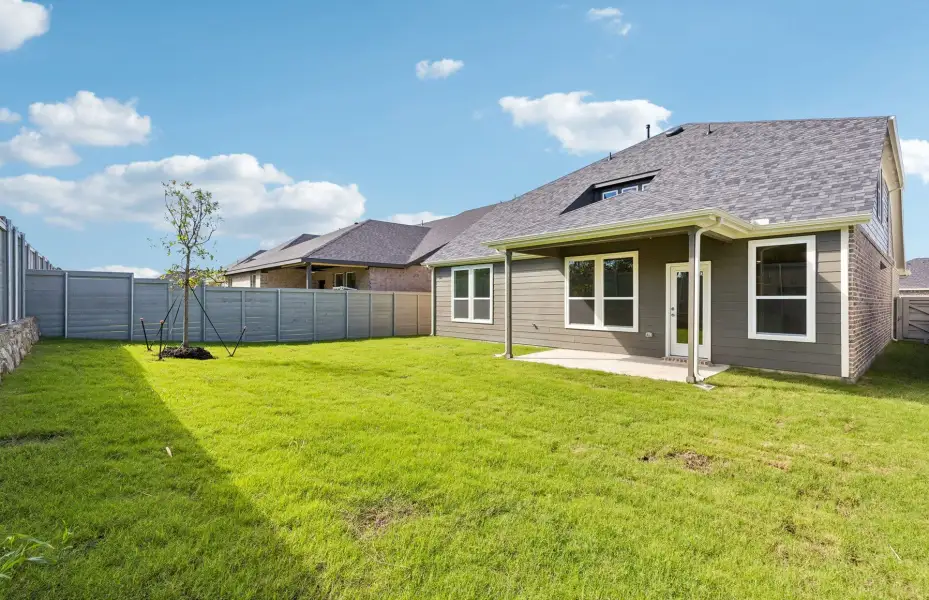 Exterior details and patio area of a home in Treeline, Justin (Image 3).