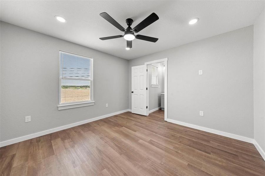 Unfurnished bedroom with wood finished floors, recessed lighting, and ceiling fan Unfurnished bedroom with wood finished floors, recessed lighting, and ceiling fan
