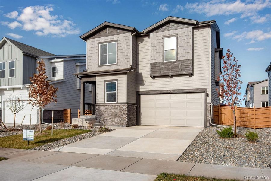 Front exterior of a new home in Medley at Reunion Ridge, Commerce City, CO, highlighting curb appeal (Image 2).