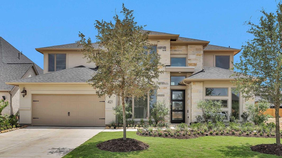 Front exterior of a new home in Grange 60', Katy, TX, highlighting curb appeal (Image 1).