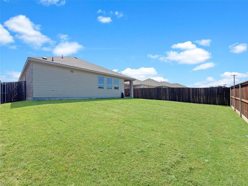 View of fenced backyard