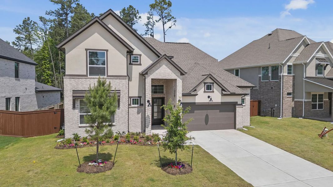 Front exterior of a new home in Evergreen 60s, Conroe, TX, highlighting curb appeal (Image 25).