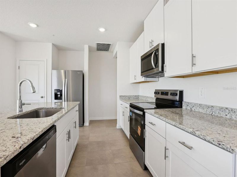 Furnished interior view inside a new home in Oakfield Trails - Premier Series, Parrish (Image 8).