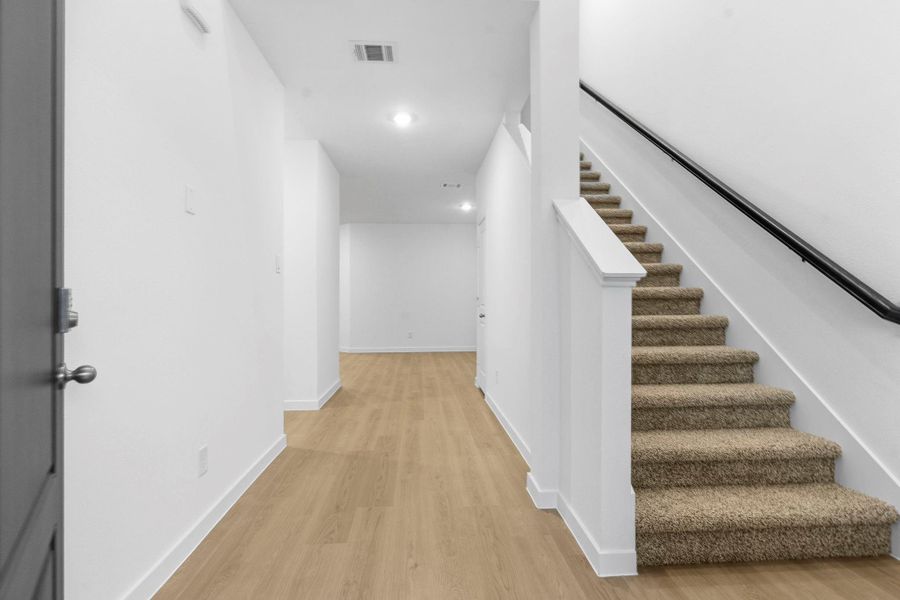 Spacious, unfurnished interior of a new home in Caldwell Crossing, Iowa Colony (Image 11).