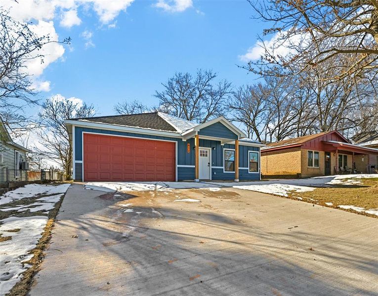 Ranch-style home featuring a garage