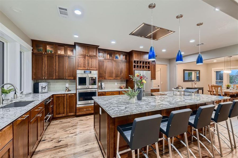 The gourmet kitchen features high end appliances and a 5' x 10' island.