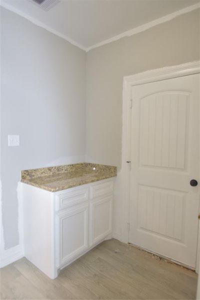 Sample of Home PART OF THE LAUNDRY ROOM BETWEEN THE GARAGE AND KITCHEN