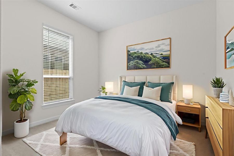 Virtually staged guest bedroom featuring large windows, natural light, and space for cozy furnishings, creating a comfortable retreat.  What I adore about this amazing one story ranch home all the bedrooms are away from each other giving everyone that privacy we all wish we had.