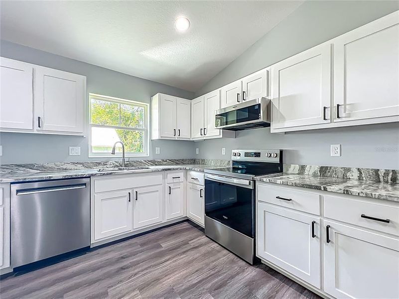 Furnished interior view inside a new home in , Lake Panasoffkee (Image 9).