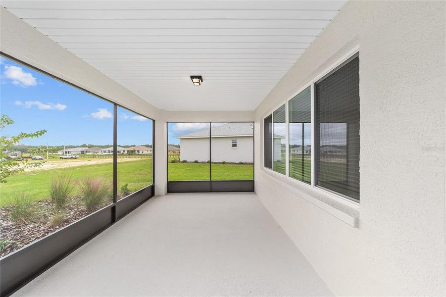 Exterior details and patio area of a home in On Top of the World Communities, Ocala (Image 3).