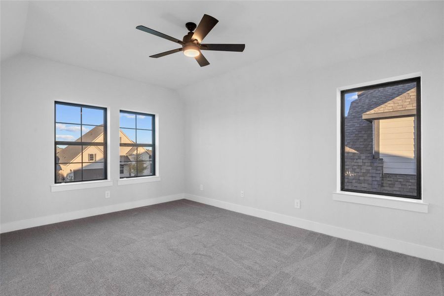 Perfect for entertaining is this amazing Game Room! This space would be a fabulous teen hangout or adult game room! Featuring plush carpet, high ceilings, custom paint and large windows!