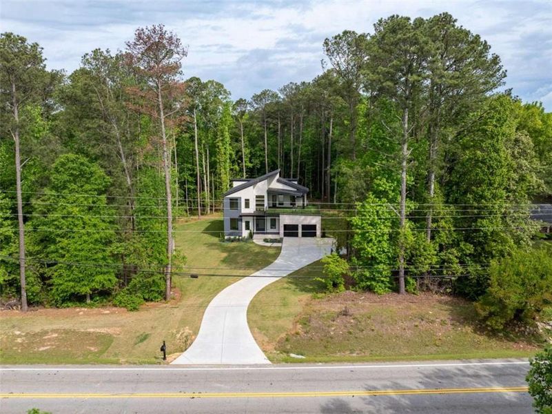 Front exterior of a new home in , South Fulton, GA, highlighting curb appeal (Image 27). Front exterior of a new home in , South Fulton, GA, highlighting curb appeal (Image 27).