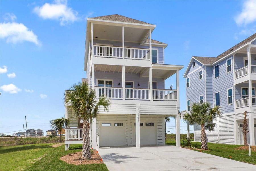 This view highlights the home’s striking beachside architecture, with a thoughtful design that balances modern construction with timeless coastal charm. Every detail is crafted for style, durability, and easy living by the sea.