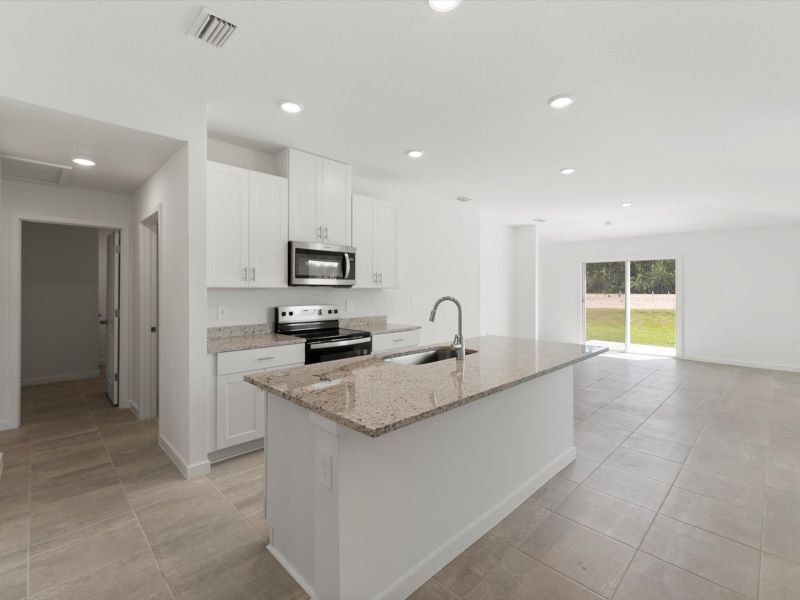 Furnished interior view inside a new home in Flagler Village - Classic Series, Palm Coast (Image 5).