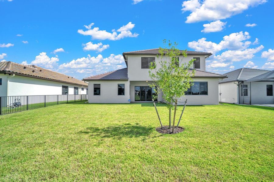 Front exterior of a new home in , Ave Maria, FL, highlighting curb appeal (Image 30).