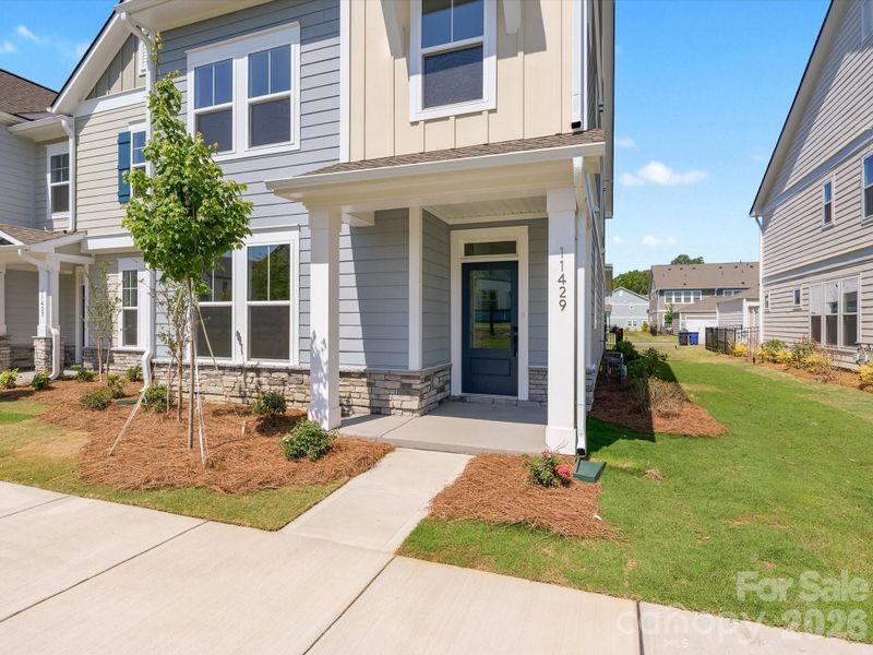 Exterior details and patio area of a home in North Creek Village - Townhomes, Huntersville (Image 4). Exterior details and patio area of a home in North Creek Village - Townhomes, Huntersville (Image 4).