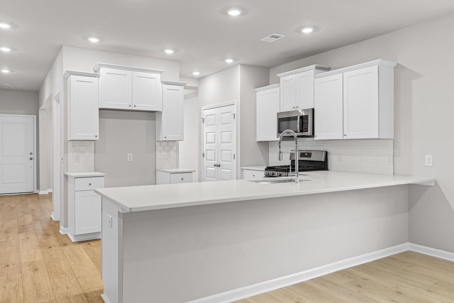 Furnished interior view inside a new home in Sweetgrass at Summers Corner, Summerville (Image 10).