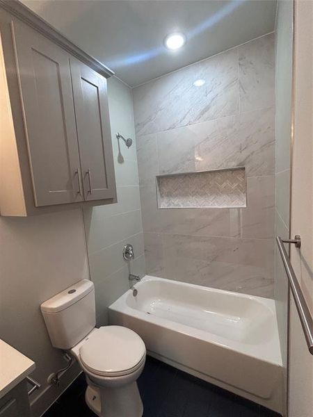 Full bath featuring vanity, shower / washtub combination, recessed lighting, and tile patterned flooring Full bath featuring vanity, shower / washtub combination, recessed lighting, and tile patterned flooring