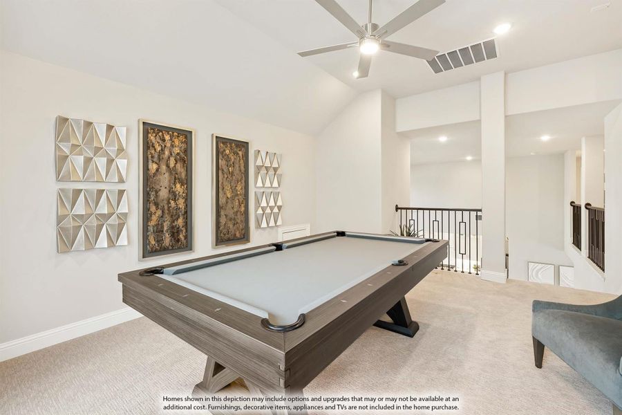 Game room with pool table, vaulted ceiling, ceiling fan, and decorative wall art near staircase landing