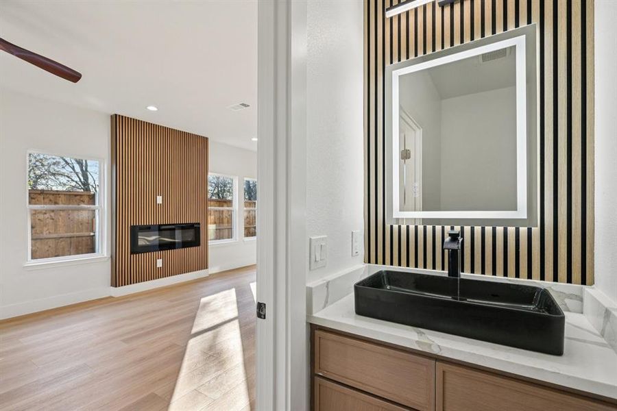Bathroom with vanity, light wood-style floors, recessed lighting, ceiling fan, and wallpapered walls
