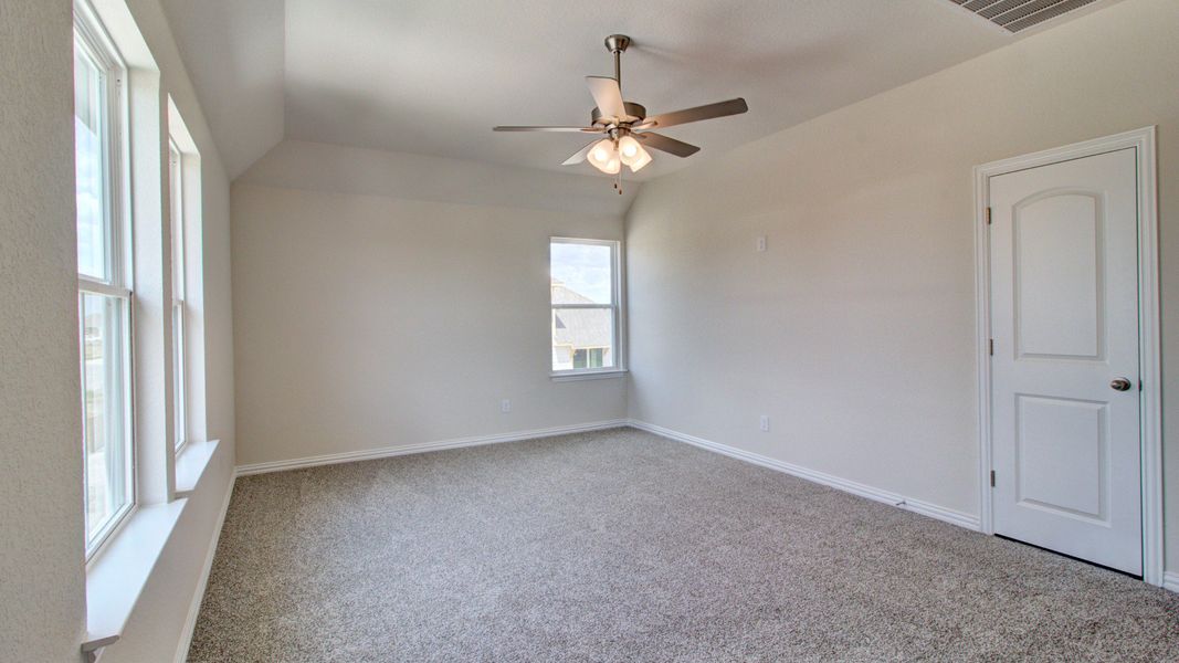 Furnished interior view inside a new home in The Crossvine, Schertz (Image 21).