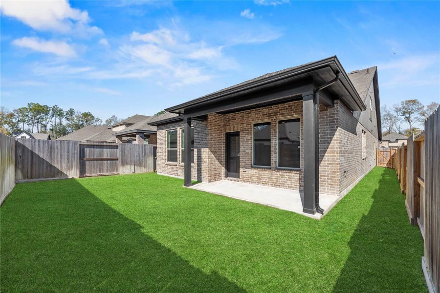 Extended covered patio is ideal for outdoor living.