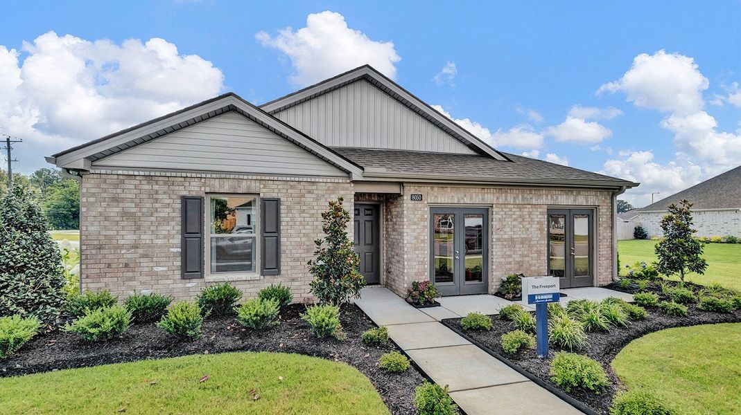 Front exterior of a new home in Huntington Estates, Millington, TN, highlighting curb appeal (Image 20).