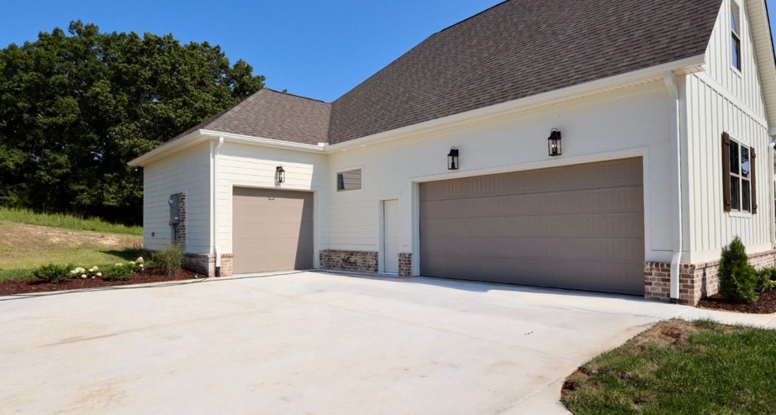 Front exterior of a new home in Baker Road, Birchwood, TN, highlighting curb appeal (Image 27).