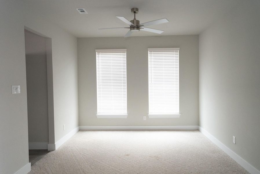 Spacious, unfurnished interior of a new home in Sunterra, Katy (Image 27).