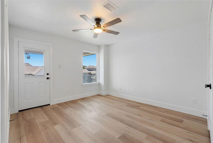 upstairs secondary bedroom with exterior door to the second-floor balcony to street views upstairs secondary bedroom with exterior door to the second-floor balcony to street views