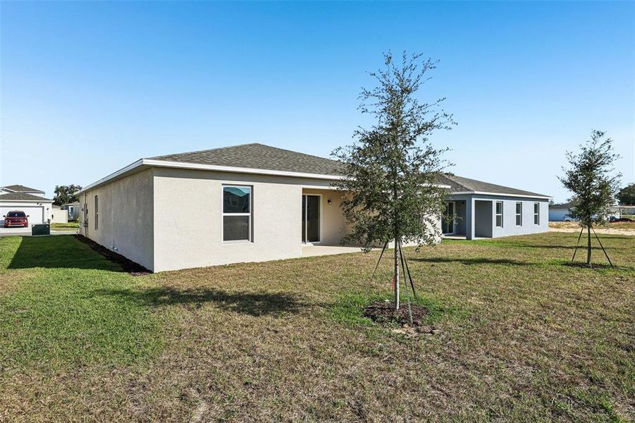 Exterior details and patio area of a home in The Collection at Bradbury Creek, Haines City (Image 7).
