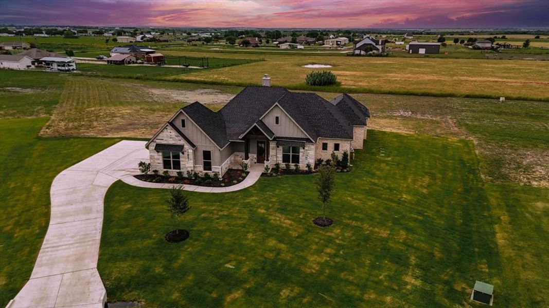 Front exterior of a new home in , Venus, TX, highlighting curb appeal (Image 2). Front exterior of a new home in , Venus, TX, highlighting curb appeal (Image 2).