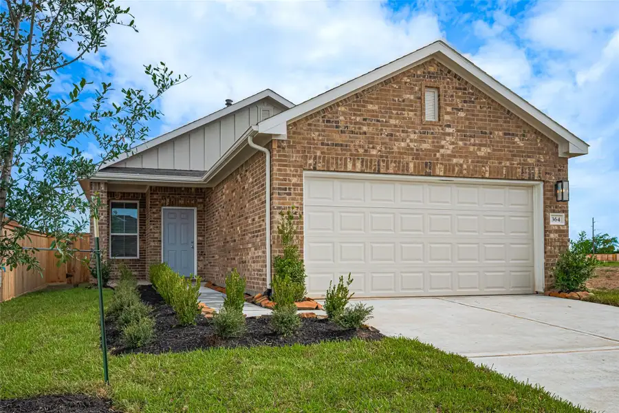 Front exterior of a new home in La Segarra, Brookshire, TX, highlighting curb appeal (Image 2). Front exterior of a new home in La Segarra, Brookshire, TX, highlighting curb appeal (Image 2).