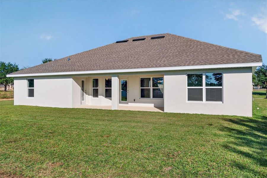 Exterior details and patio area of a home in Hill Country Estates, Dade City (Image 28).