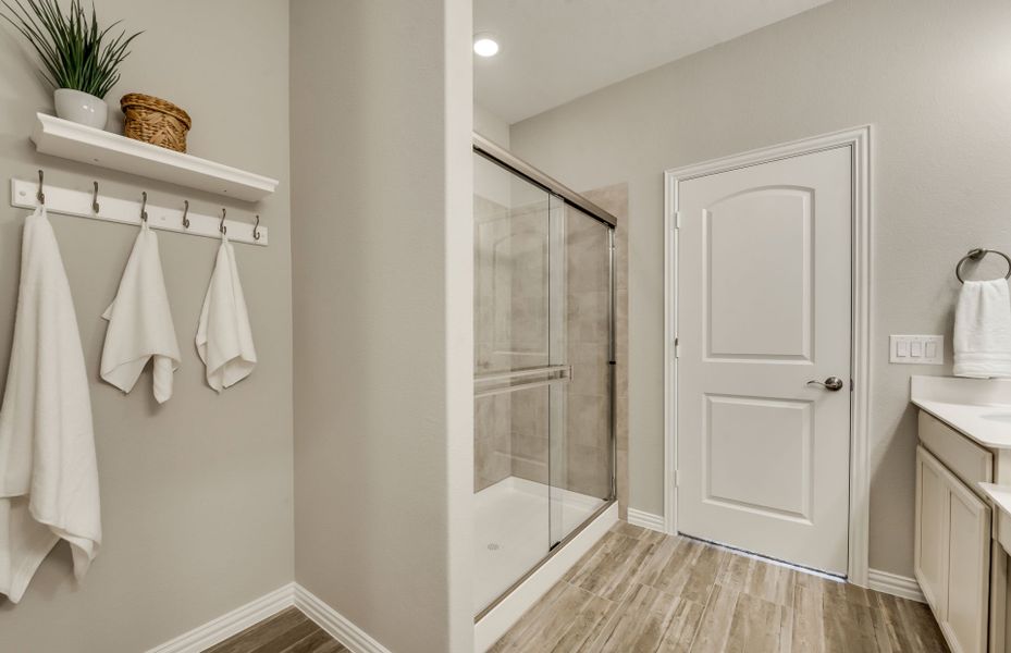 Spacious owner's bath with large shower