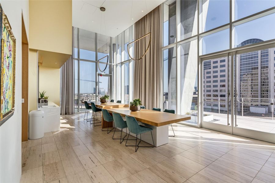 Floor-to-ceiling windows frame cityscape views in this impressive communal dining area. Floor-to-ceiling windows frame cityscape views in this impressive communal dining area.