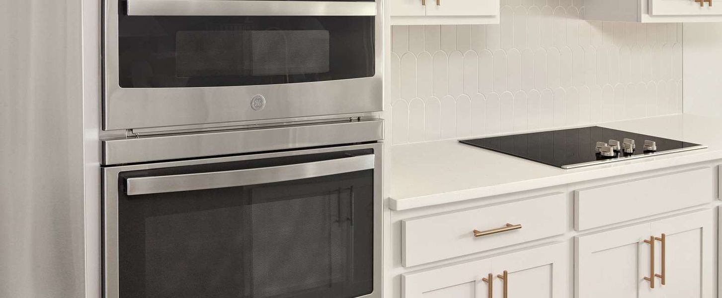 Visual of the gourmet kitchen layout with the stacked oven and microwave and flat top range with vent hood and AW Collection® Serene - Representative images and renderings are for illustrative purposes Visual of the gourmet kitchen layout with the stacked oven and microwave and flat top range with vent hood and AW Collection® Serene - Representative images and renderings are for illustrative purposes